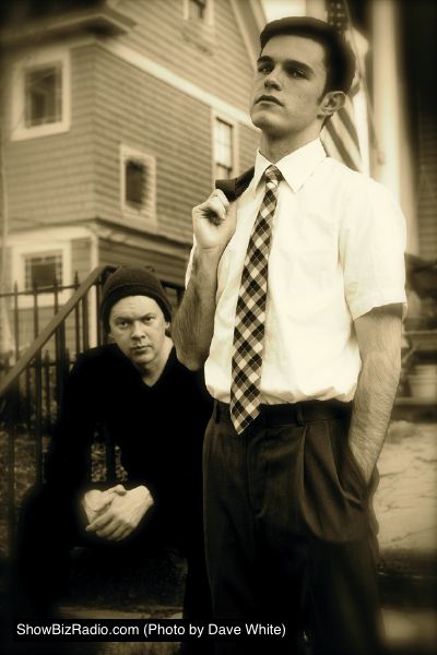 Dean Knight (left, sitting) as the older Tom and Deejay Gray (right, standing) as the younger Tom