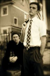 Dean Knight (left, sitting) as the older Tom and Deejay Gray (right, standing) as the younger Tom